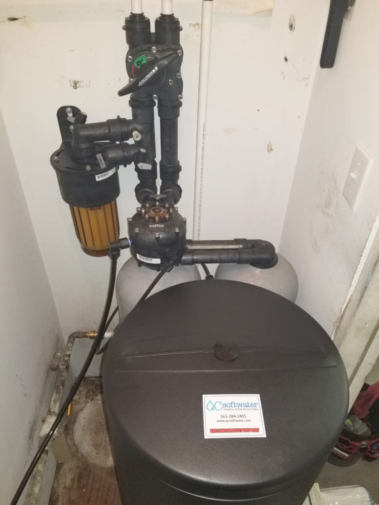 Kinetico water softener installed in a tight space in New Boston, Illinois