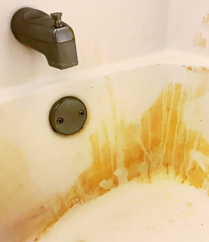 Iron in the water and iron stain in a bathtub.